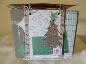 Background stamping, tree cut from the Sparkle and Shine paper, and the trimmed edge of the paper lines the sides